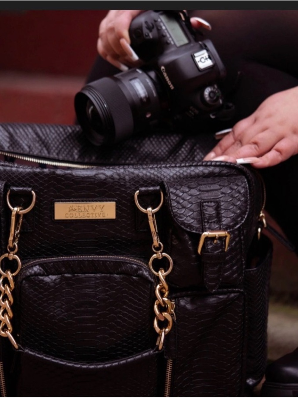 The Envy Collective Camera Bag. Black Faux-Skin Tote with Gold Chain Details